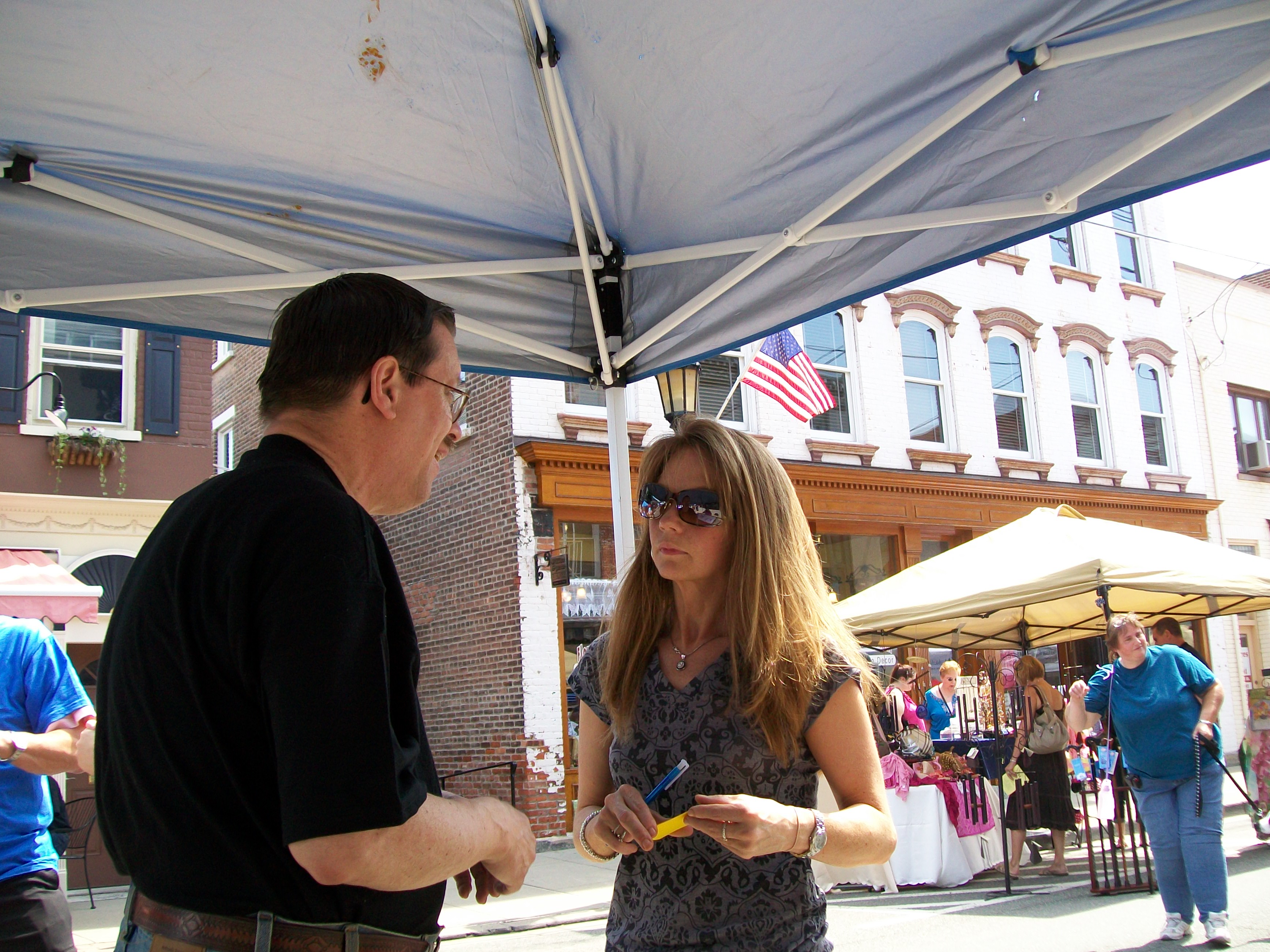 Mayor Becker speaking with a resident